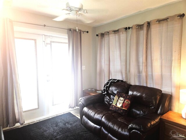 5358 Jenny Cir, Pace, FL 32571 - living area with ceiling fan and healthy amount of natural light