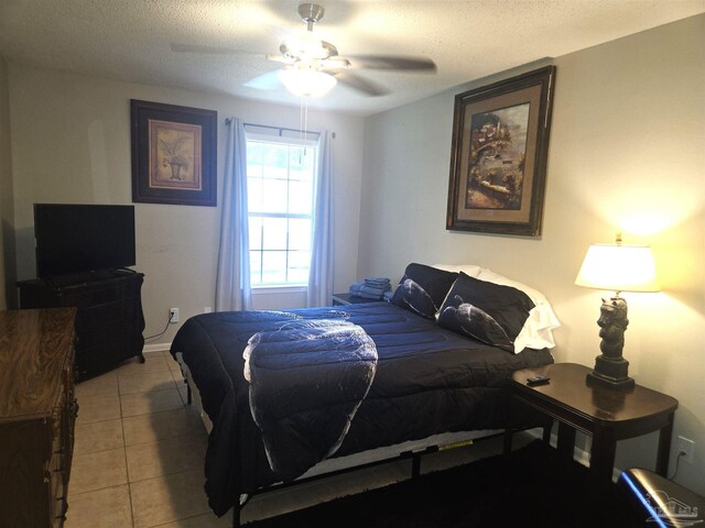 5358 Jenny Cir, Pace, FL 32571 - bedroom featuring tile patterned floors, a ceiling fan, and a textured ceiling