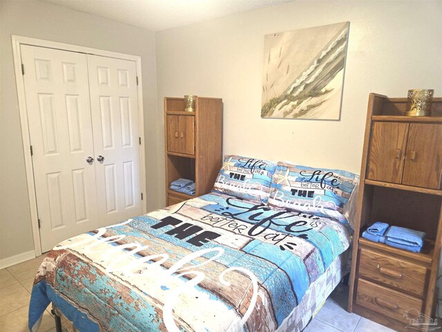 5358 Jenny Cir, Pace, FL 32571 - bedroom featuring light tile patterned floors and a closet