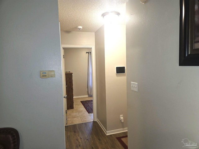 5358 Jenny Cir, Pace, FL 32571 - hall with wood finished floors and a textured ceiling