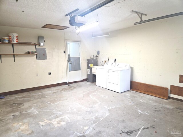 5358 Jenny Cir, Pace, FL 32571 - garage with independent washer and dryer, water heater, a garage door opener, and electric panel
