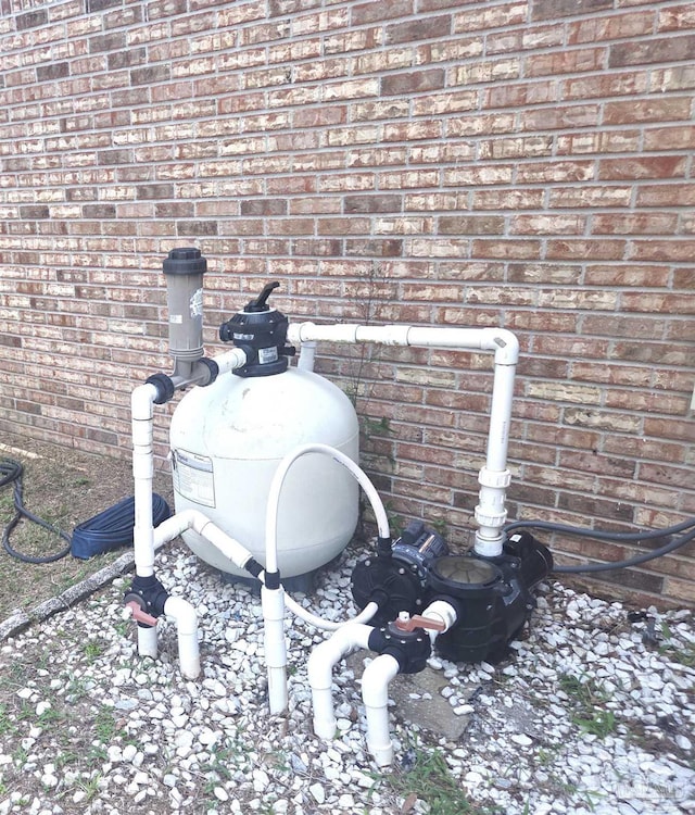 5358 Jenny Cir, Pace, FL 32571 - exterior view of brick siding and pump