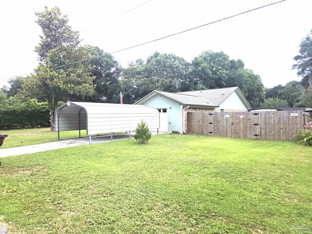 5358 Jenny Cir, Pace, FL 32571 - view of yard with a carport and driveway