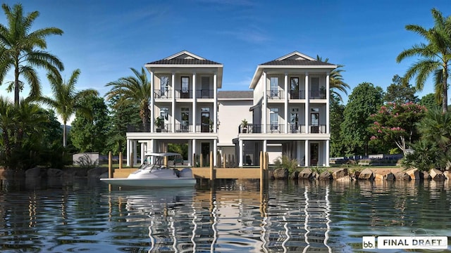 back of property with a balcony and a water view