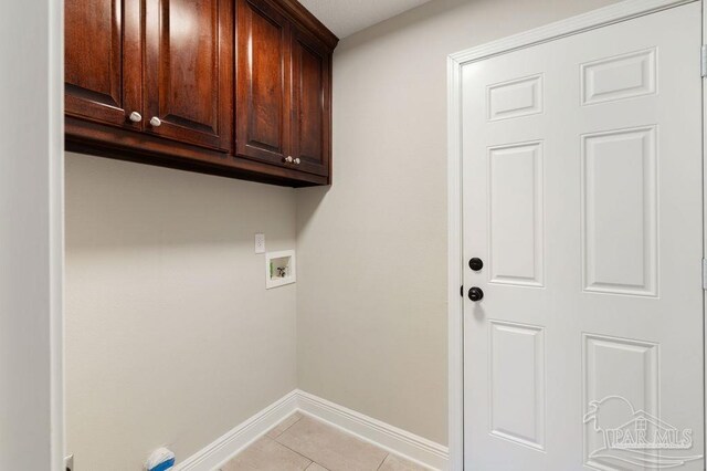 9317 Alekai Dr, Pensacola, FL 32526 - washroom with cabinet space, hookup for a washing machine, and light tile patterned floors