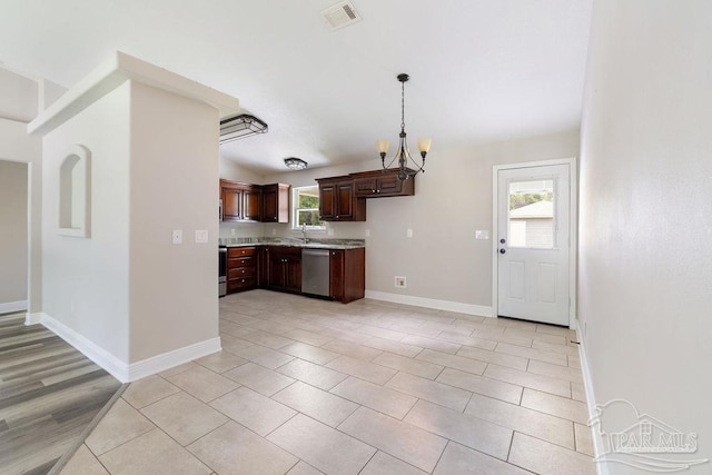 9317 Alekai Dr, Pensacola, FL 32526 - kitchen with dishwasher, light countertops, a chandelier, pendant lighting, and dark brown cabinetry