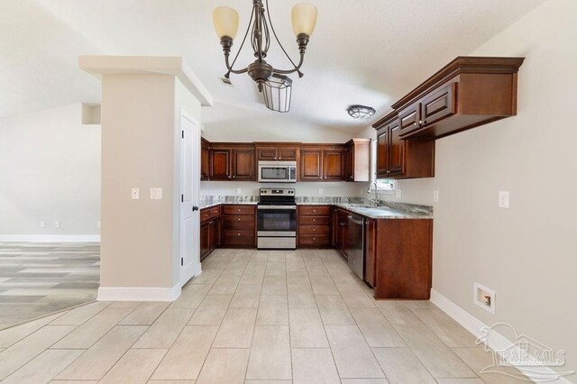 9317 Alekai Dr, Pensacola, FL 32526 - kitchen with appliances with stainless steel finishes, a chandelier, and lofted ceiling