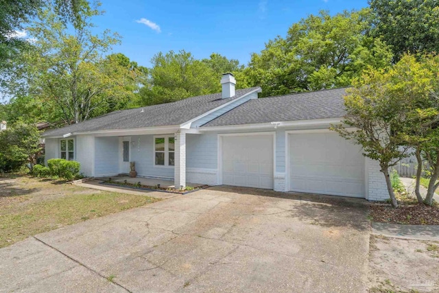 8150 Northpointe Blvd, Pensacola, FL 32514 - ranch-style home featuring a garage, brick siding, concrete driveway, and a shingled roof