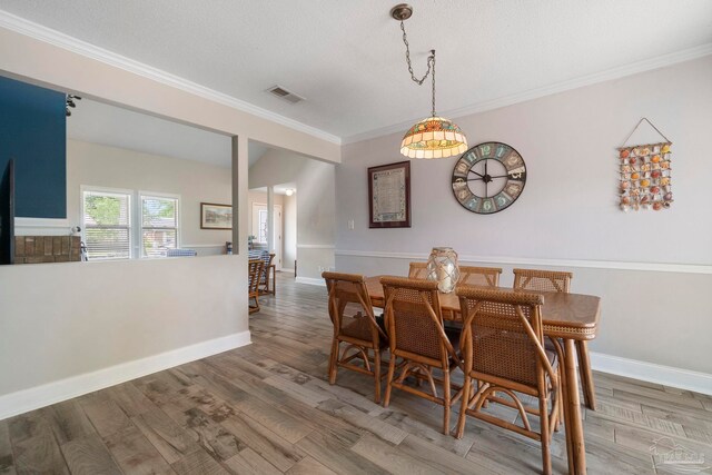 8150 Northpointe Blvd, Pensacola, FL 32514 - dining area featuring ornamental molding, wood finished floors, and baseboards
