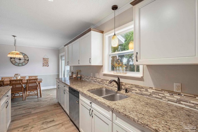 8150 Northpointe Blvd, Pensacola, FL 32514 - kitchen featuring a sink, stainless steel dishwasher, crown molding, light wood-style flooring, and backsplash