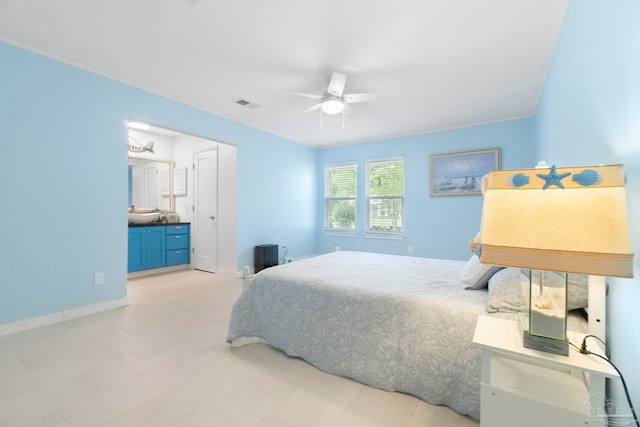 8150 Northpointe Blvd, Pensacola, FL 32514 - bedroom featuring a ceiling fan, baseboards, and ensuite bath