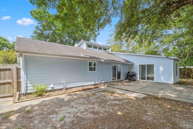 8150 Northpointe Blvd, Pensacola, FL 32514 - back of house with a patio area, fence, and a shingled roof