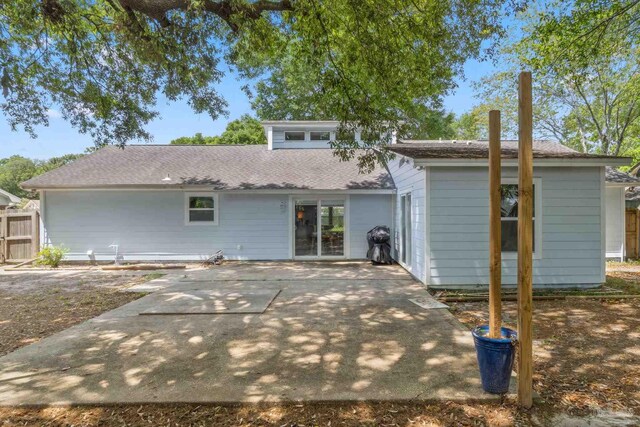 8150 Northpointe Blvd, Pensacola, FL 32514 - rear view of house with a patio area, fence, and roof with shingles