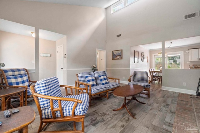 8150 Northpointe Blvd, Pensacola, FL 32514 - living area with plenty of natural light, wood finished floors, baseboards, and a high ceiling