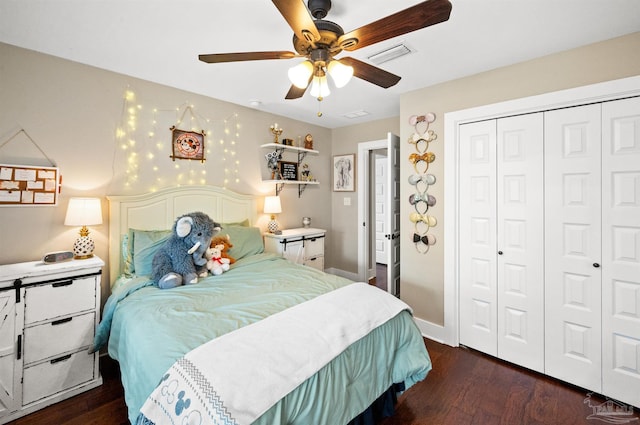 bedroom with ceiling fan, a closet, and dark hardwood / wood-style floors