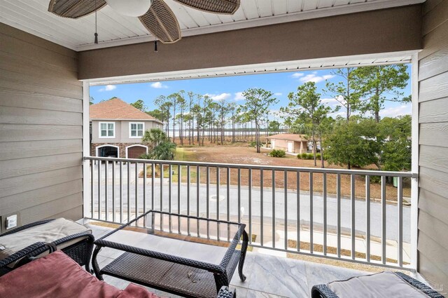 balcony featuring ceiling fan