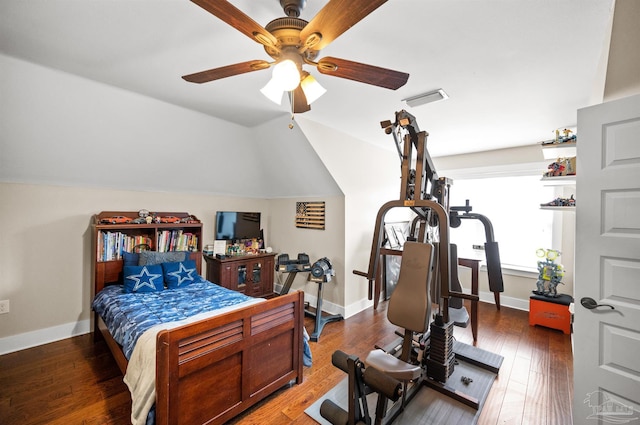 bedroom featuring ceiling fan, vaulted ceiling, and dark wood-type flooring