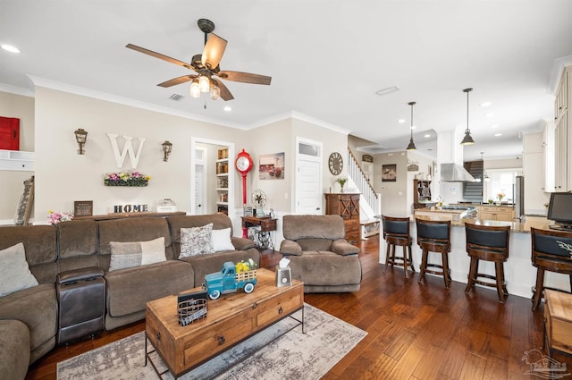 living room with ceiling fan, crown molding, and dark hardwood / wood-style floors