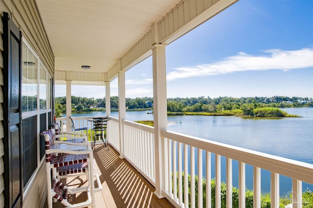 balcony featuring a water view
