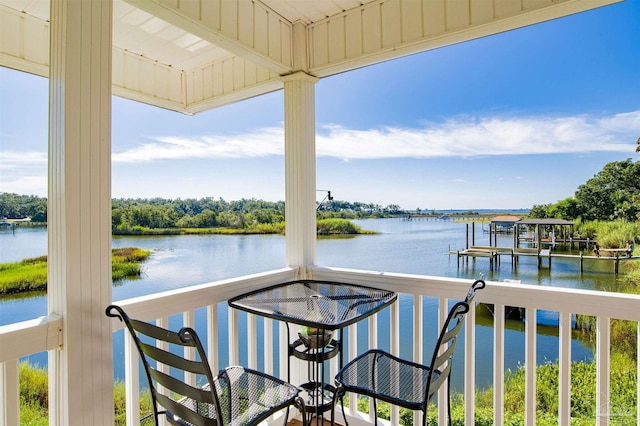 balcony featuring a water view