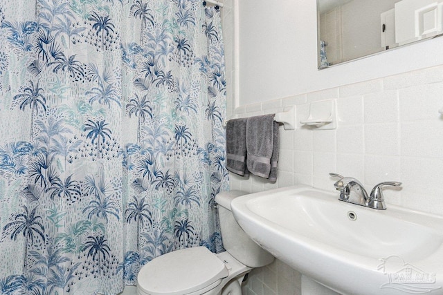 4662 Oakland Dr, Pensacola, FL 32526 - full bath with tile walls and a shower with shower curtain