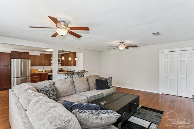 4662 Oakland Dr, Pensacola, FL 32526 - living area with ceiling fan and dark wood-style floors