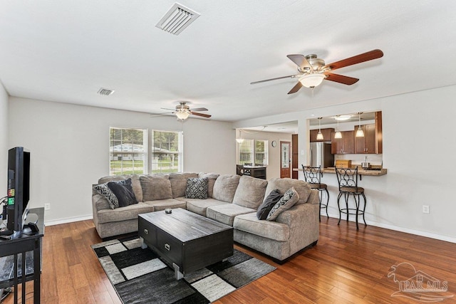 4662 Oakland Dr, Pensacola, FL 32526 - living room with ceiling fan and dark wood-style flooring