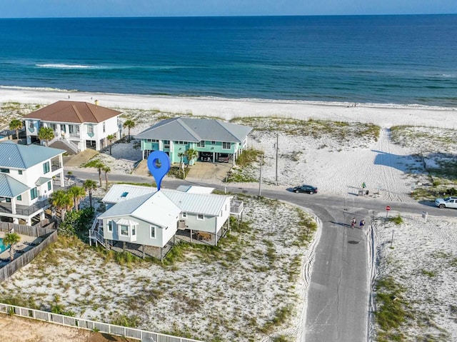 drone / aerial view with a view of the beach and a water view