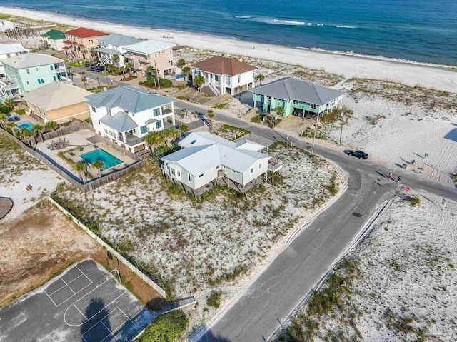 bird's eye view with a beach view and a water view