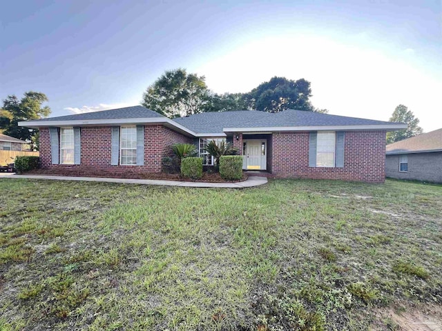 4888 La Casa Cir, Pace, FL 32571 - single story home featuring brick siding and a front lawn