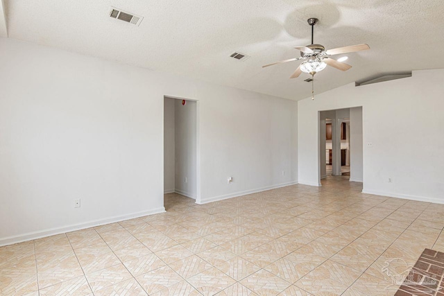 10449 Bernice Rd, Milton, FL 32583 - spare room featuring a ceiling fan, lofted ceiling, a textured ceiling, and baseboards