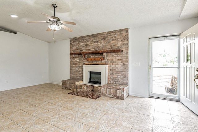 10449 Bernice Rd, Milton, FL 32583 - unfurnished living room with a textured ceiling, ceiling fan, a fireplace, and baseboards