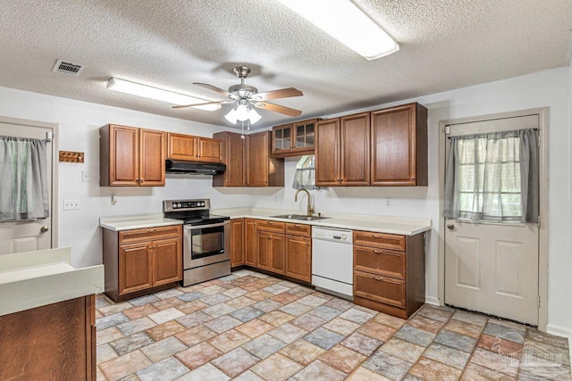 10449 Bernice Rd, Milton, FL 32583 - kitchen featuring stainless steel electric stove, a sink, white dishwasher, under cabinet range hood, and light countertops