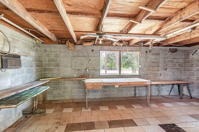 10449 Bernice Rd, Milton, FL 32583 - below grade area with ceiling fan, a workshop area, and a wall mounted air conditioner