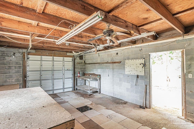 10449 Bernice Rd, Milton, FL 32583 - garage with concrete block wall and ceiling fan