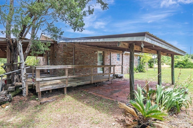 10449 Bernice Rd, Milton, FL 32583 - view of side of home with brick siding and a deck
