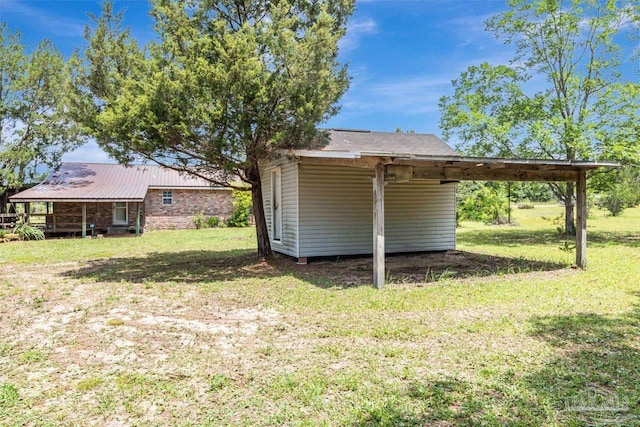 10449 Bernice Rd, Milton, FL 32583 - view of grassy yard featuring a carport