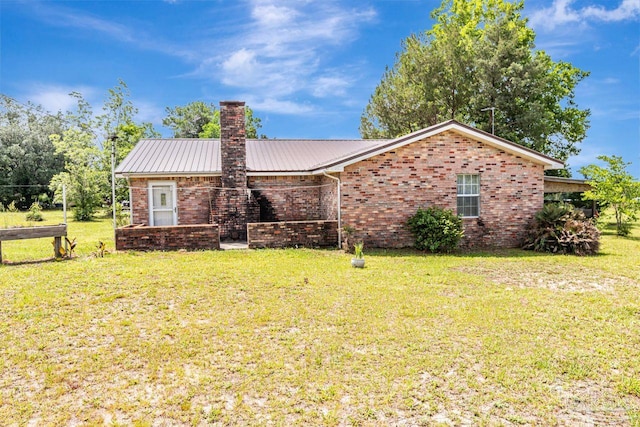 10449 Bernice Rd, Milton, FL 32583 - single story home featuring a chimney, brick siding, and a front yard