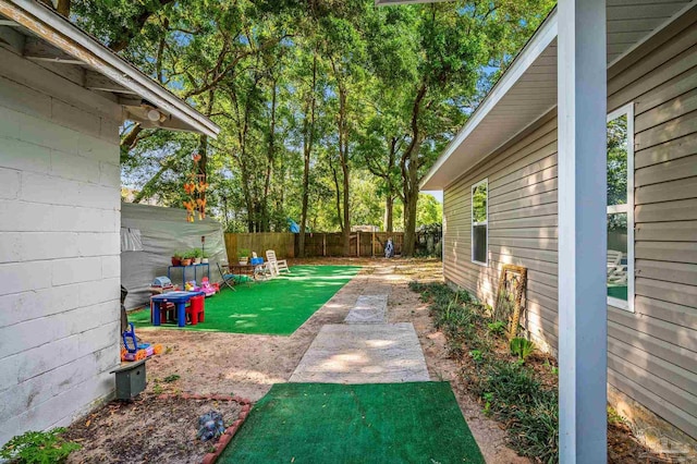 view of yard with a fenced backyard
