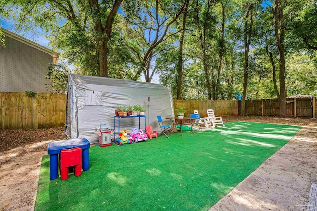 view of yard with a fenced backyard