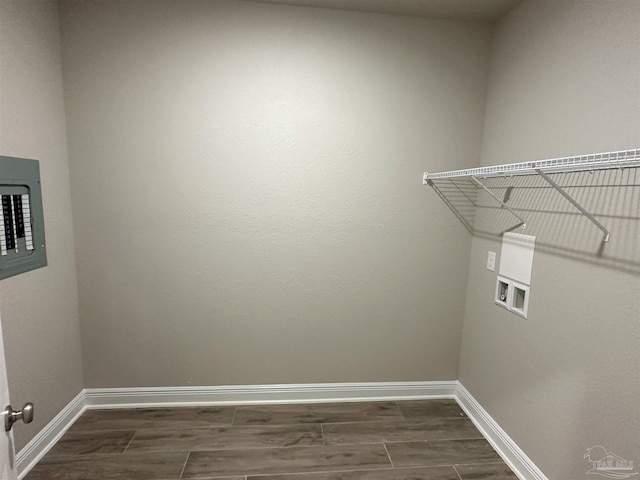 laundry room featuring dark hardwood / wood-style flooring, washer hookup, and electric panel