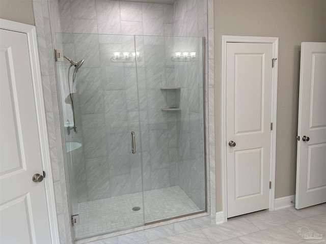 bathroom with a shower with shower door