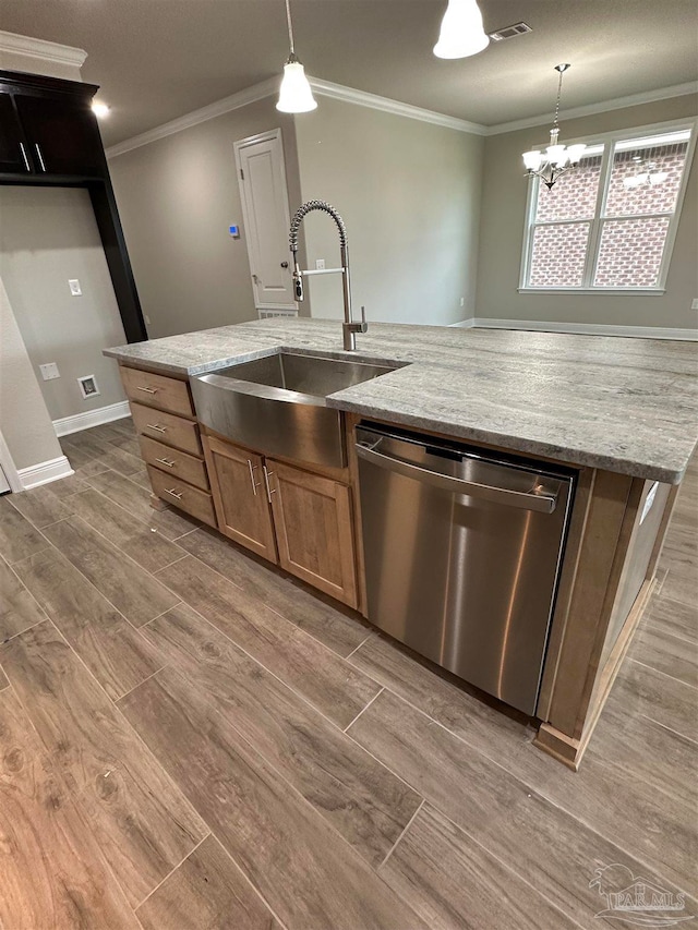 kitchen with light stone counters, dishwasher, sink, and dark hardwood / wood-style flooring