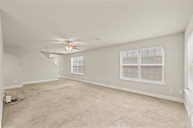 unfurnished room with light carpet and ceiling fan