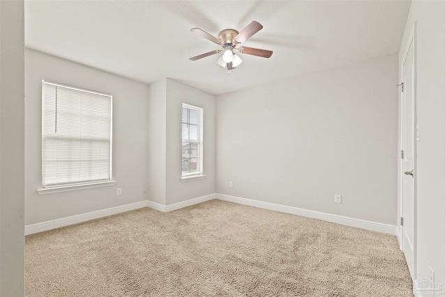 carpeted empty room with ceiling fan