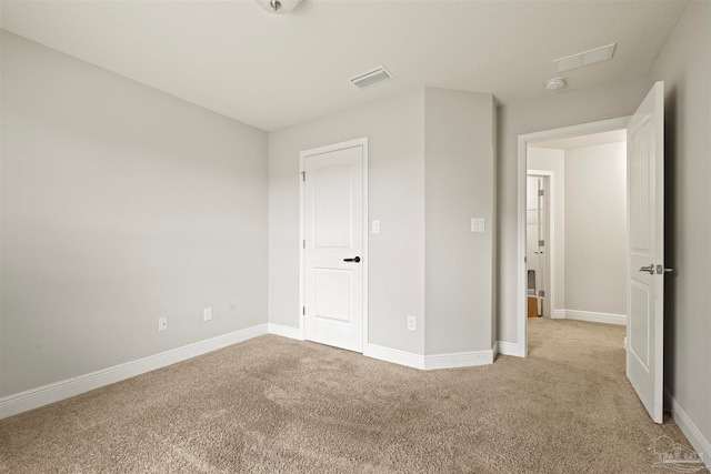 unfurnished bedroom with light colored carpet