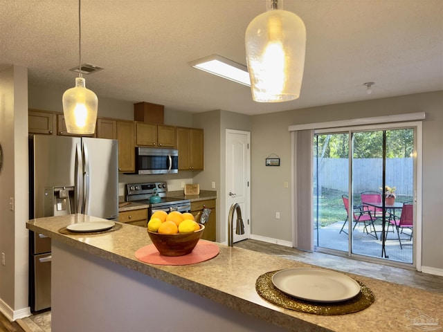 8037 Nalo Creek Loop, Pensacola, FL 32514 - kitchen featuring appliances with stainless steel finishes and pendant lighting