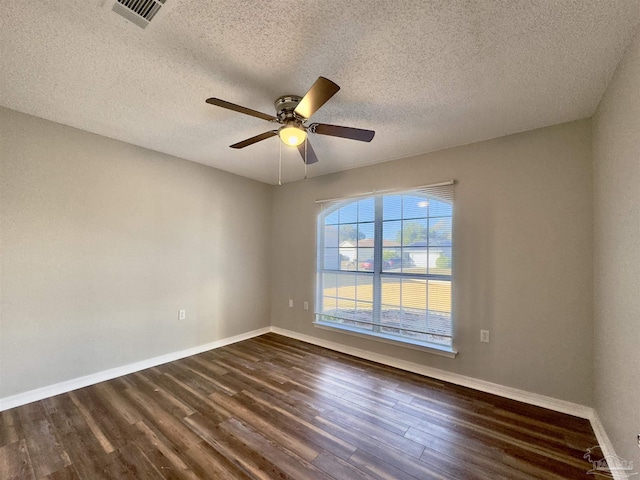 8037 Nalo Creek Loop, Pensacola, FL 32514 - empty room with dark wood-style flooring, a ceiling fan, and a textured ceiling