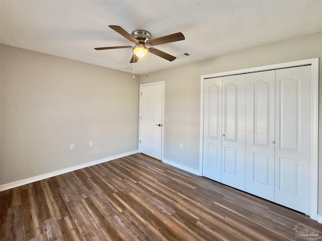 8037 Nalo Creek Loop, Pensacola, FL 32514 - unfurnished bedroom with dark wood-style floors, a closet, a textured ceiling, and ceiling fan