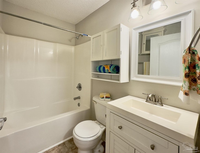 full bathroom featuring vanity, a textured ceiling, washtub / shower combination, tile patterned flooring, and toilet